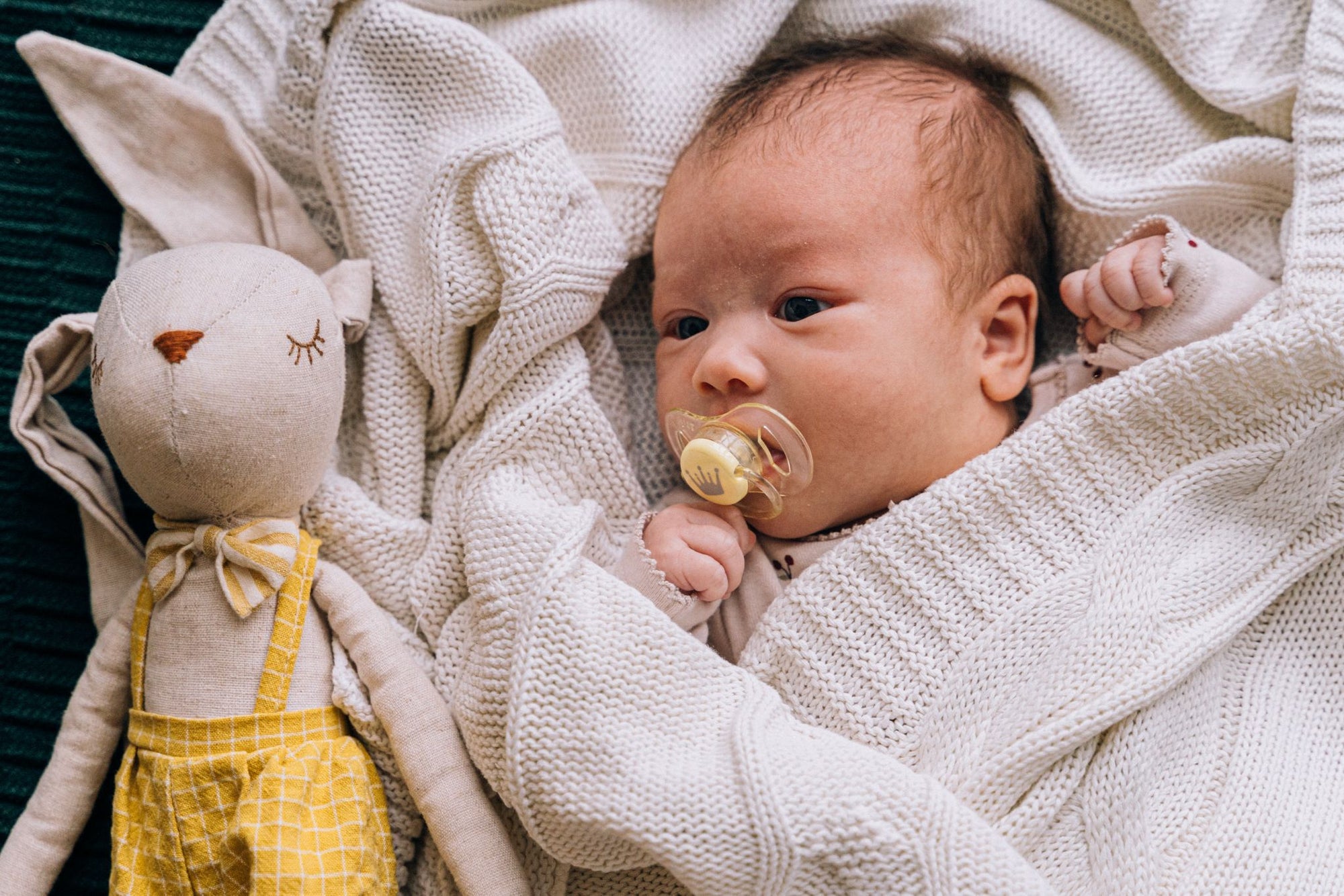 baby in organic fabric blanket