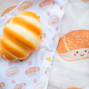 the wee bean organic cotton bib in bakery buns with sausage bun, cocktail bun and coconut cream bun