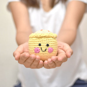 holding baby playing with the wee bean siu mai dim sum doll fair-trade dolls pebblechild