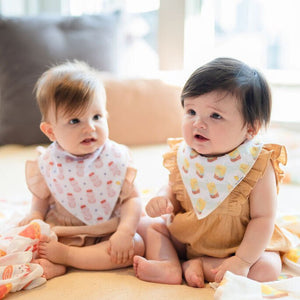 two babies in the wee bean organic cotton baby bandana bib set in vita lemon tea and yakult yogurt drink