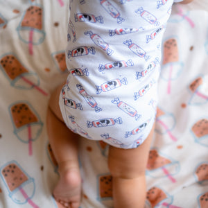 cute baby crawling and wearing the wee bean organic cotton onesie romper bodysuit in white rabbit candy