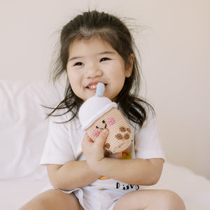 the wee bean cute girl playing with the handmade fair-trade boba bubble tea doll