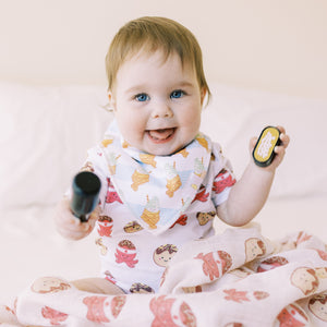 cute baby playing in the wee bean takoyaki onesie and taiyaki fish sundae bib set