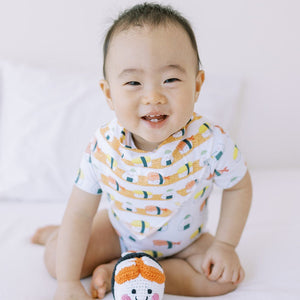 cute baby wearing the wee bean organic cotton baby bandana bibs in sushi nigiri onigiri from taste of japan collection