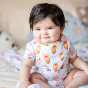 cute baby wearing the wee bean organic cotton bib in egg waffle sundae